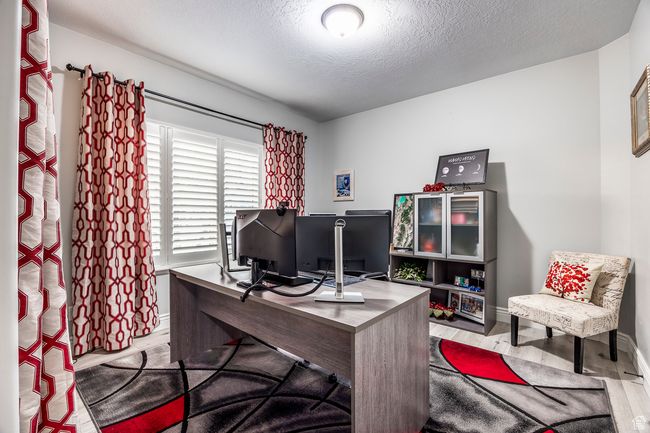 Office area featuring light hardwood / wood-style flooring and a textured ceiling | Image 25