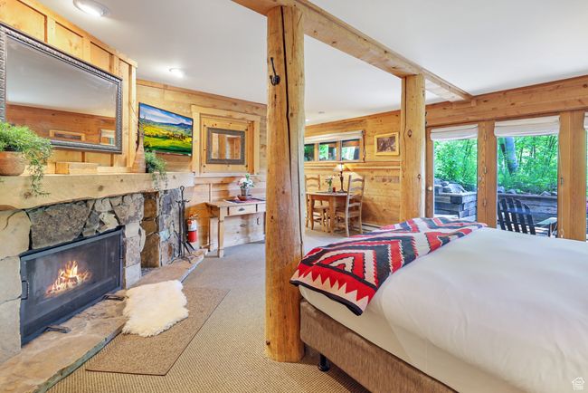 Studio suite with king bed, wood-burning fireplace, dining area, kitchenette and full bath. Opens to deck and hot tub | Image 36