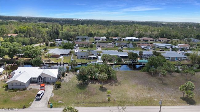 Drone / aerial view featuring a residential view, a wooded view, and a water view | Image 5