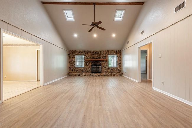Stone fireplace shares the charm of the original home | Image 8