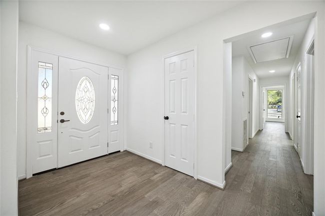 Another perspective of the spacious entry, facing the hallway leading to the bedrooms. | Image 6