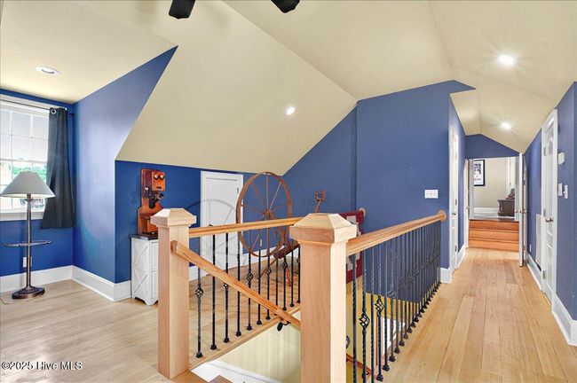 Stairs down returning to the mud/laundry room at side entrance | Image 78