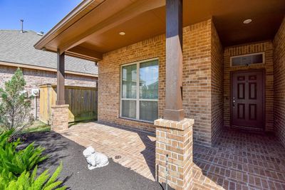 All brick front porch which provides ample room for a sitting area. | Image 2