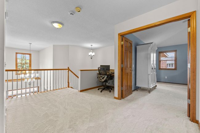 Large loft upstairs has new carpeting and features a built in desk | Image 26