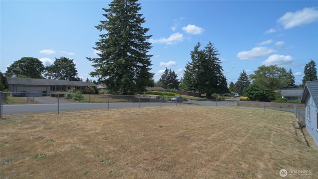 Wide and Fully Fenced lot offers a peaceful suburban feel with well-kept neighboring homes perfect for enjoying outdoor activities | Image 14