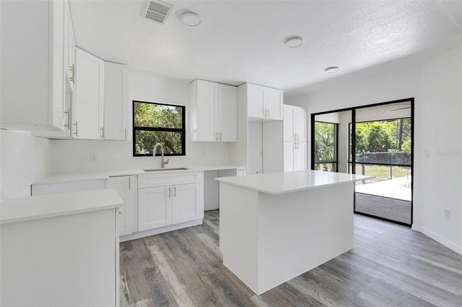 New appliances installed before closing quartz countertops and backsplash in newly renovated kitchen | Image 6