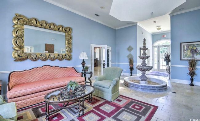 Living area featuring french doors and ornamental molding | Image 8