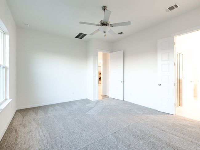 Unfurnished bedroom featuring carpet flooring and a ceiling fan | Image 30