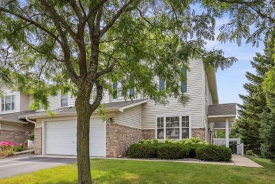 Two car garage is extra deep for additional storage and includes a work bench | Image 2