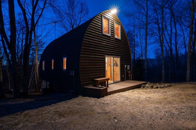 The guest cabin includes all of the amenities with a kitchen, bedroom loft and bathroom. | Image 11