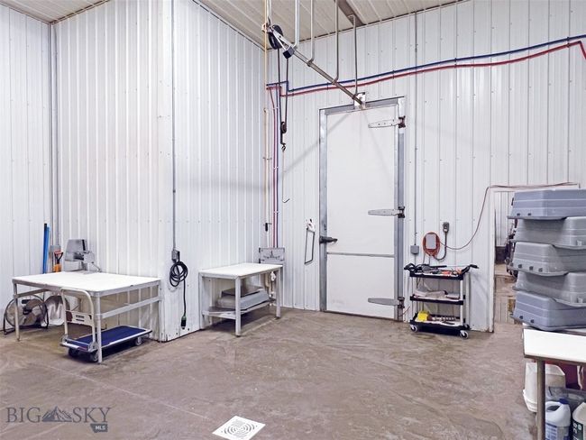 cutting tables and cooler entrance | Image 10