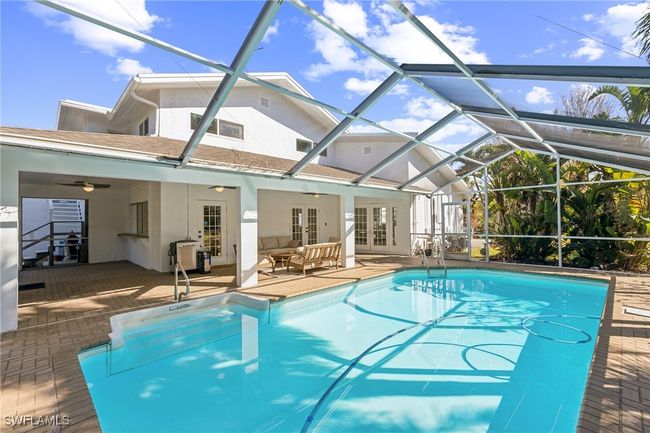 Pool, french doors, an outdoor hangout area, and a patio area | Image 9