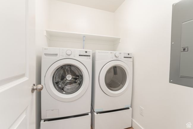 Clothes washing area with electric panel, washer and dryer, and laundry area | Image 15