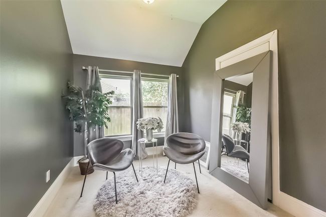 Natural light streams in through the window, highlighting the neutral wall color. Perfect for a small sitting area or reading nook. | Image 19