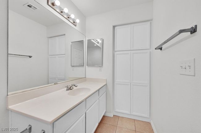 Bathroom with vanity and tile patterned flooring | Image 18