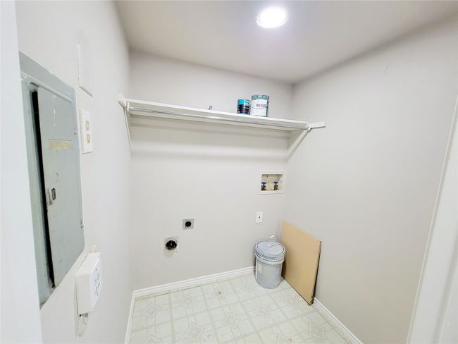 Washroom with hookup for a washing machine and electric dryer hookup | Image 21