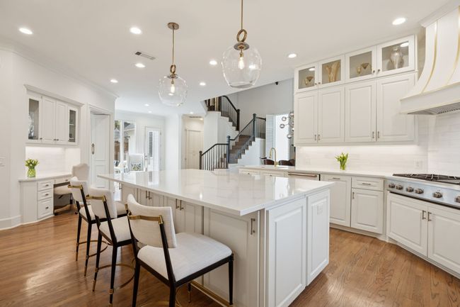 Gourmet kitchen with center island and top of the line appliances | Image 7