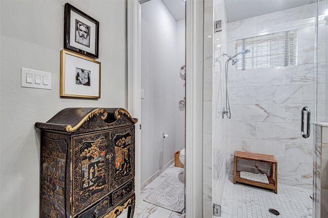 Full bathroom with a shower stall, marble finish floor, and toilet | Image 20