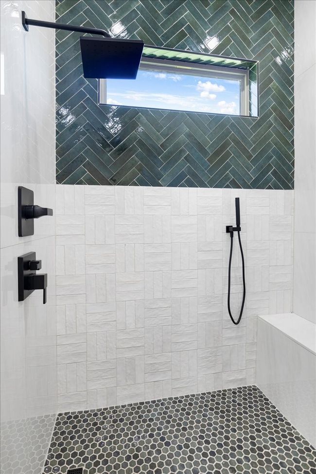Bathroom featuring a tile shower | Image 22