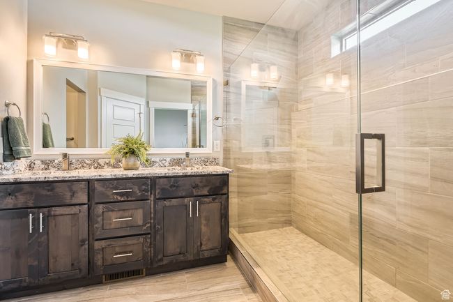 Full bath with a tile shower and double vanity | Image 15