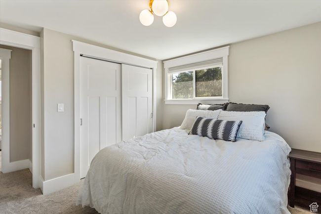 Bedroom with carpet and a closet | Image 24