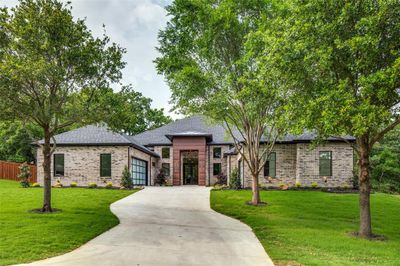 View of front of property featuring a front lawn and a garage | Image 2