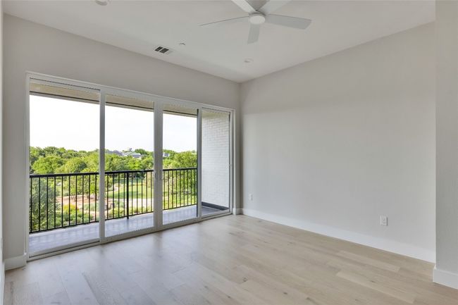 Empty room featuring light wood-style floors, a ceiling fan, and baseboards | Image 36