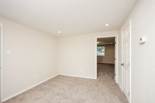 Spare room with light carpet and recessed lighting | Image 19