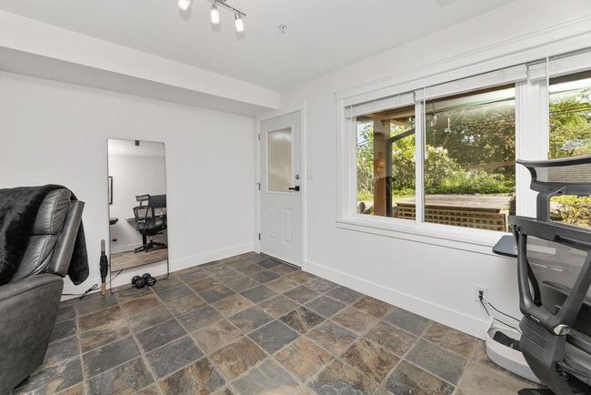Downstairs recreation area/family room that could be converted to a third bedroom or used as a home business with separate entry | Image 33