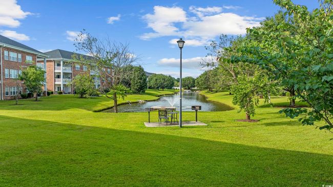 Surrounding community featuring a water view and a lawn | Image 32
