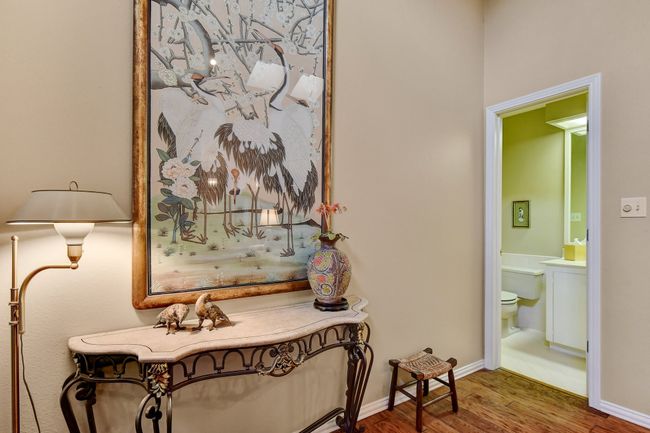 Hall with wood finished floors and baseboards | Image 6