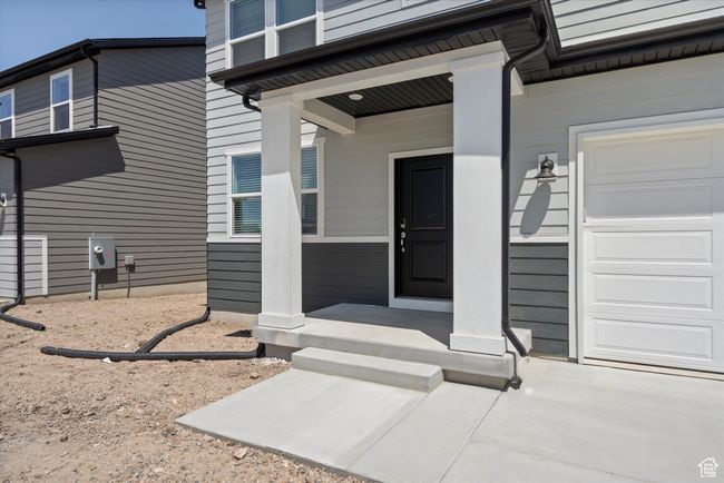 Entrance to property featuring an attached garage | Image 7