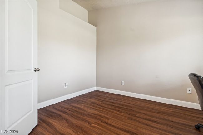 Unfurnished room featuring dark wood-type flooring and baseboards | Image 10