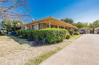 View of side of home with a yard | Image 2