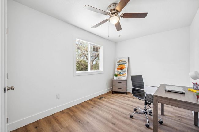 Office area featuring baseboards, ceiling fan, and wood finished floors | Image 19