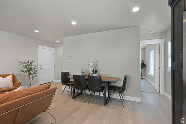 Dining space featuring light wood finished floors and recessed lighting | Image 8