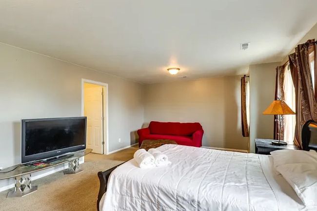 Bedroom featuring baseboards, visible vents, and carpet floors | Image 13