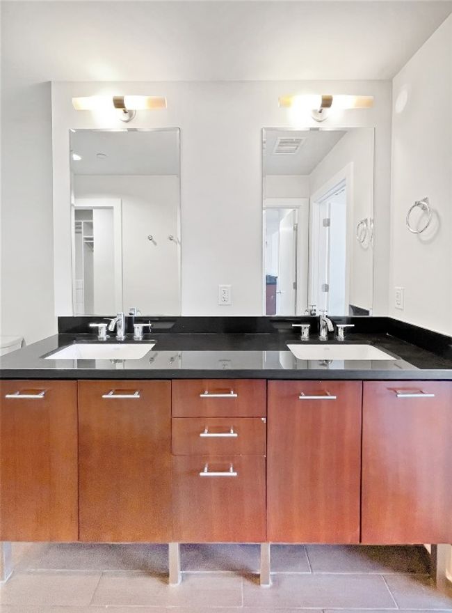 Bathroom with tile patterned flooring and double vanity | Image 18