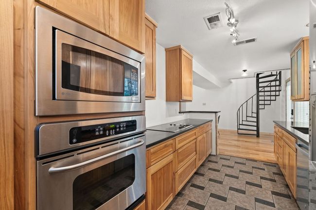 Kitchen featuring appliances with stainless steel finishes and granite countertops | Image 14