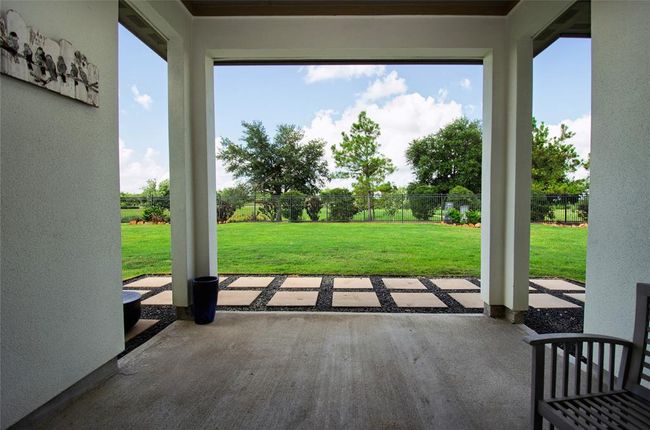 View out from the covered patio to the pond with no back neighbors. | Image 29