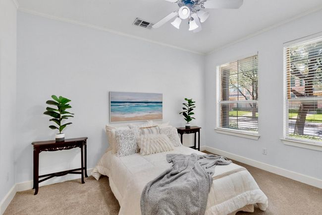 Carpeted bedroom featuring ornamental molding and a ceiling fan | Image 33