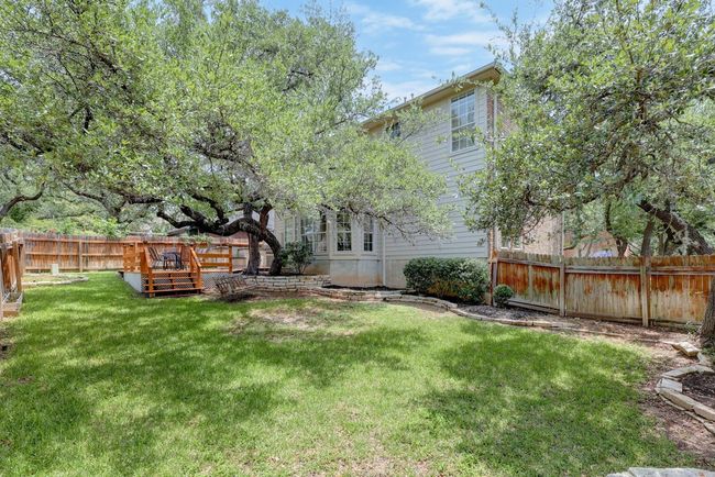 View of yard featuring a wooden deck | Image 36