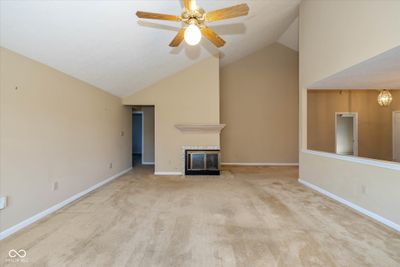 Great room has a 2 sided, gas log fireplace | Image 3