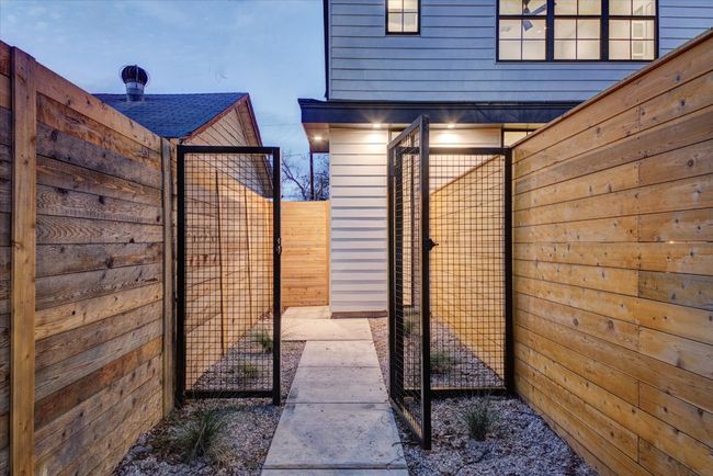 The entire property is fully fenced with 8 an foot privacy fence and gated access in the front and back. | Image 7