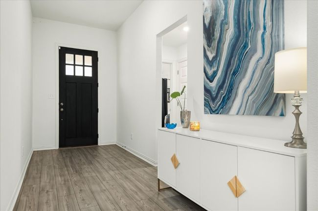 Foyer with baseboards and wood finished floors | Image 7