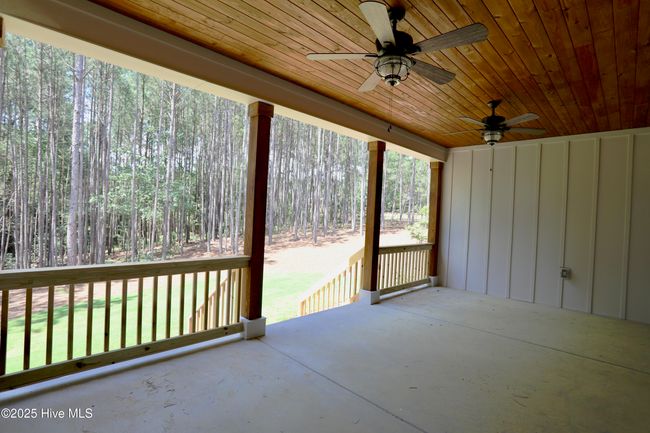 Enjoyable backyard entertainment in covered back porch | Image 38