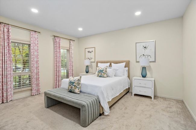 Primary bedroom with en suite bath and a walk-in closet | Image 15