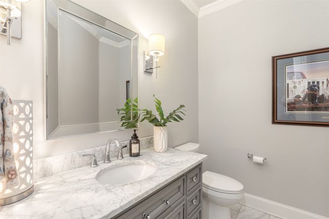 Half bathroom off of the kitchen. | Image 22