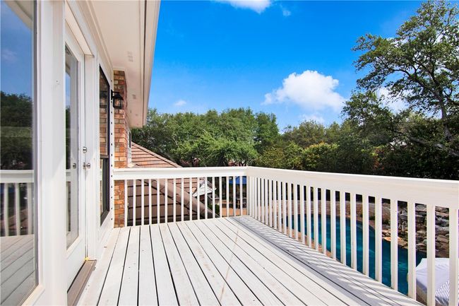 Deck off playroom/2nd living, overlooking the lushly landscaped yard and pool | Image 31