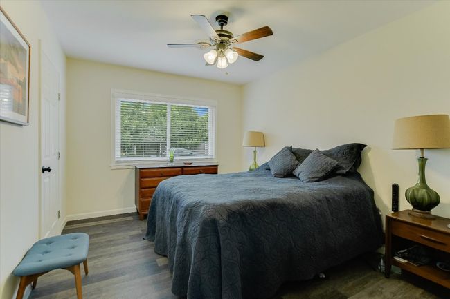 Bedroom featuring dark wood finished floors, baseboards, and ceiling fan | Image 15